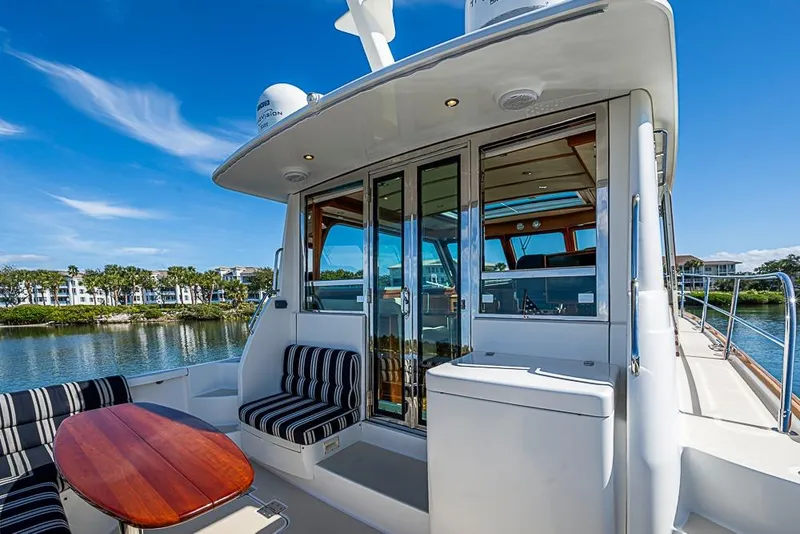 Slide: The Image of 2016 Sabre 42 Salon Express yacht with elegant seating and scenic water view. - 13