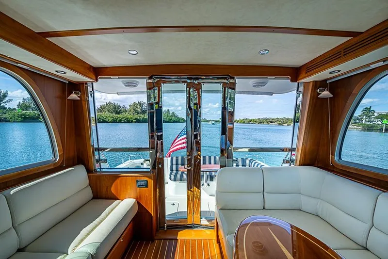 Slide: The Image of Interior of 2016 Sabre 42 Salon Express yacht with scenic water view. - 21