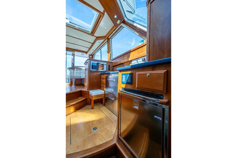 Slide: The Image of Interior of 2016 Sabre 42 Salon Express yacht, featuring elegant wood finishes and modern amenities. - 29