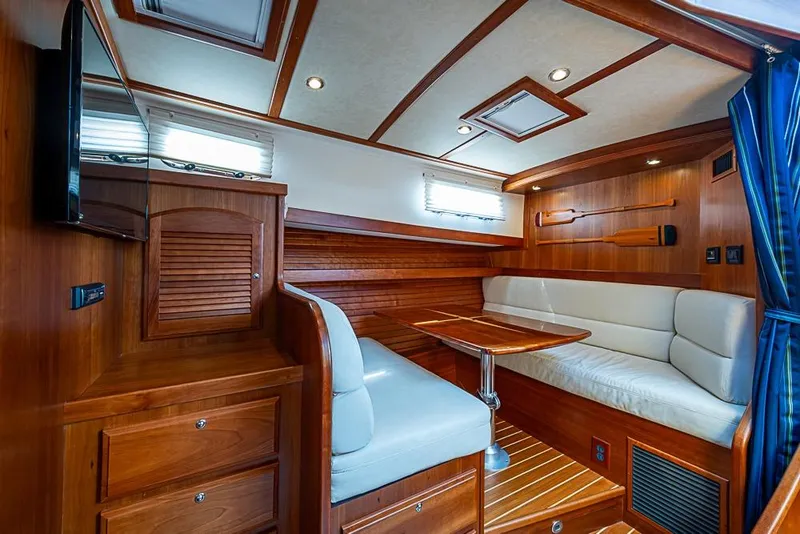 Slide: The Image of 2016 Sabre 42 Salon Express interior with wood finish and cozy seating area. - 31