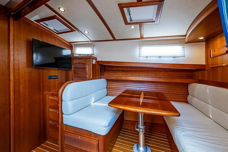 Slide: The Image of Luxurious interior of 2016 Sabre 42 Salon Express yacht with wood finish and seating area. - 32