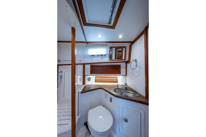 Slide: The Image of Luxurious bathroom in 2016 Sabre 42 Salon Express yacht with wood accents and modern fixtures. - 39