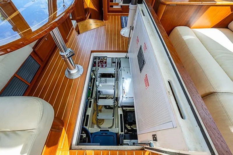 Slide: The Image of Engine compartment of 2016 Sabre 42 Salon Express yacht, featuring wooden interior and seating. - 41
