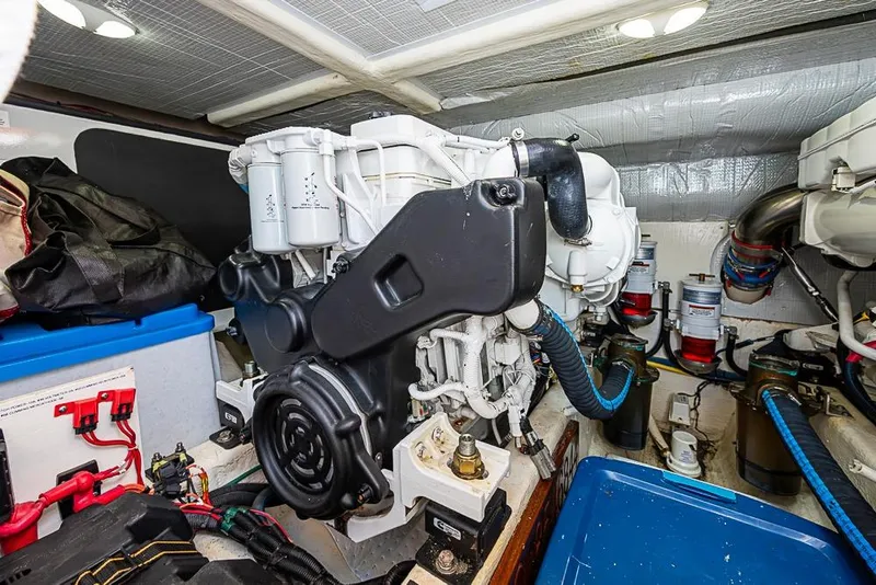 Slide: The Image of Engine room of 2016 Sabre 42 Salon Express, showcasing mechanical components and wiring. - 44