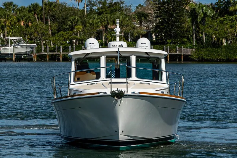 Slide: The Image of 2016 Sabre 42 Salon Express yacht cruising on a serene waterway. - 6