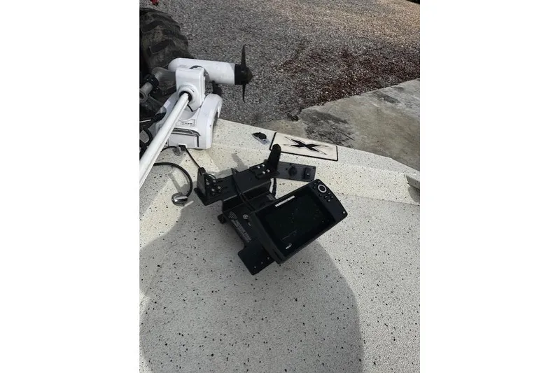 Slide: The Image of 2017 Xpress H20B Bay boat deck with mounted equipment and trolling motor. - 10