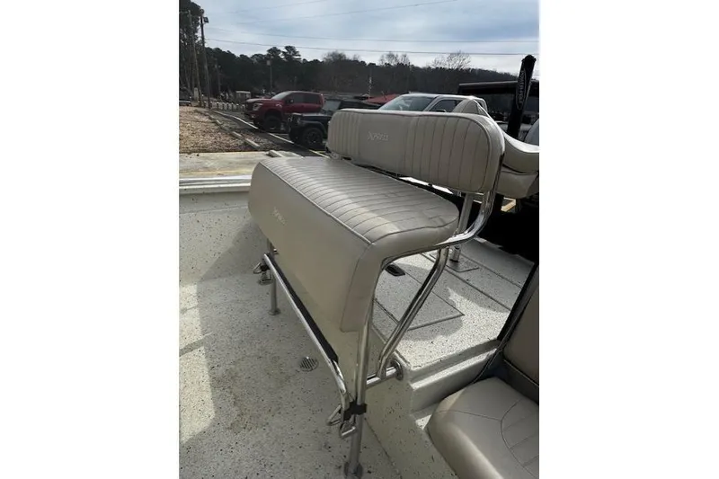 Slide: The Image of 2017 Xpress H20B Bay boat with beige seating and chrome frame. - 11