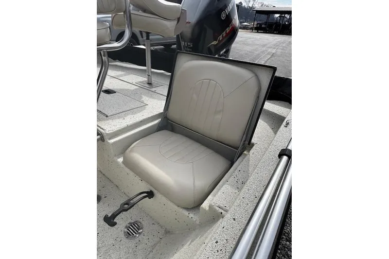 Slide: The Image of 2017 Xpress H20B Bay boat seat with Yamaha engine in background. - 4