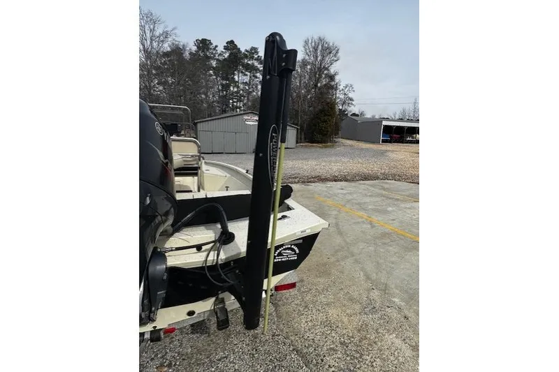 Slide: The Image of 2017 Xpress H20B Bay boat with Power-Pole anchor in a parking area. - 6