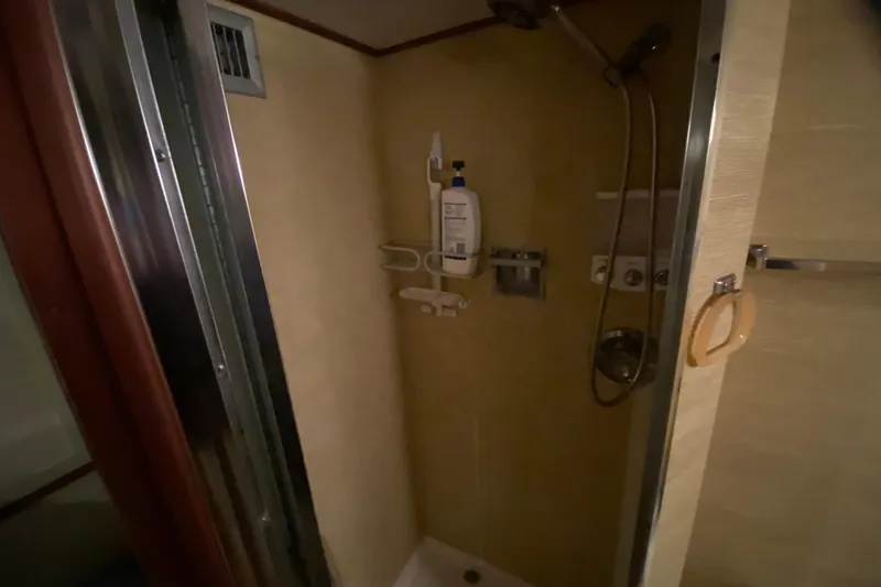 Slide: The Image of Shower area in 1977 Bertram 42 Flybridge Motor Yacht, featuring modern fixtures. - 22