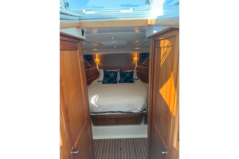 Slide: The Image of Luxurious cabin interior of 2023 Back Cove 340 boat with cozy bedding. - 10