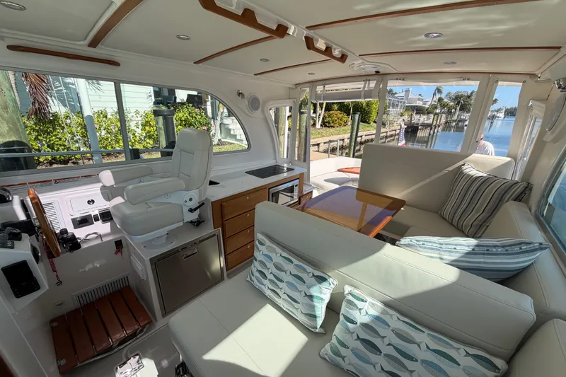 Slide: The Image of Luxurious interior of 2023 Back Cove 340 yacht with plush seating and elegant design. - 17