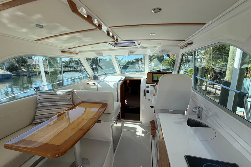 Slide: The Image of Interior of 2023 Back Cove 340 yacht, featuring elegant seating and modern amenities. - 18