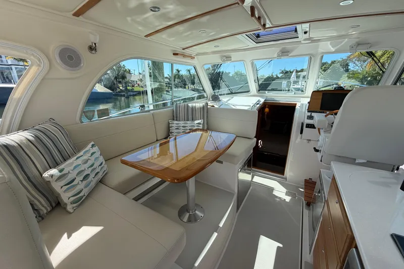 Slide: The Image of Luxurious interior of 2023 Back Cove 340 yacht with elegant seating and wooden table. - 20