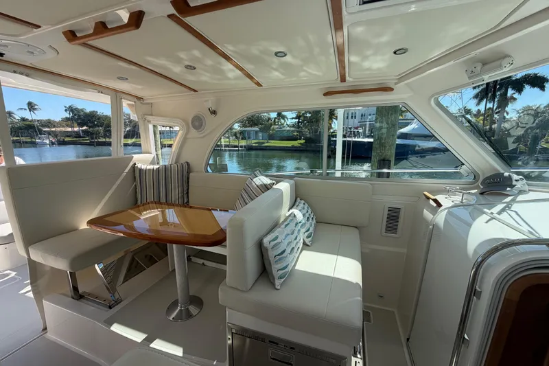 Slide: The Image of Luxurious interior of 2023 Back Cove 340 yacht with elegant seating and waterfront view. - 22