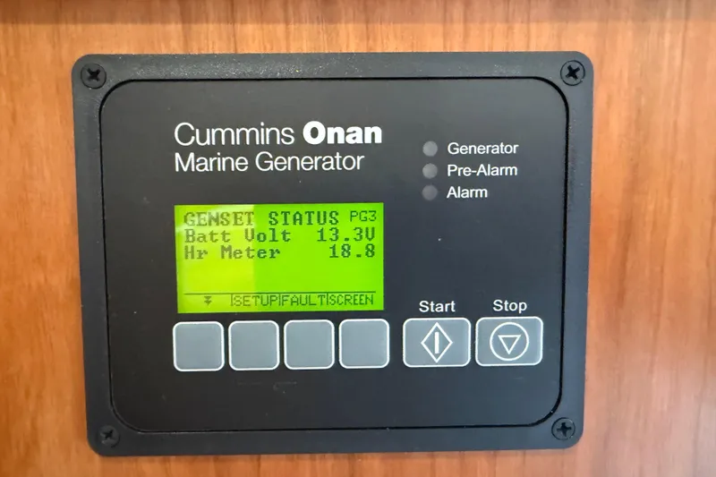 Slide: The Image of Cummins Onan marine generator display on 2023 Back Cove 340, showing battery voltage and hour meter. - 30