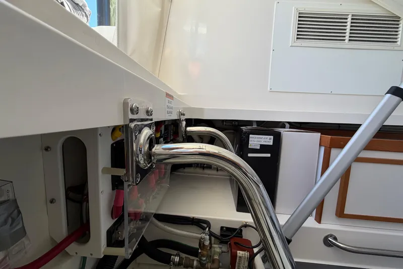 Slide: The Image of 2023 Back Cove 340 boat interior showing engine compartment and metal fittings. - 38
