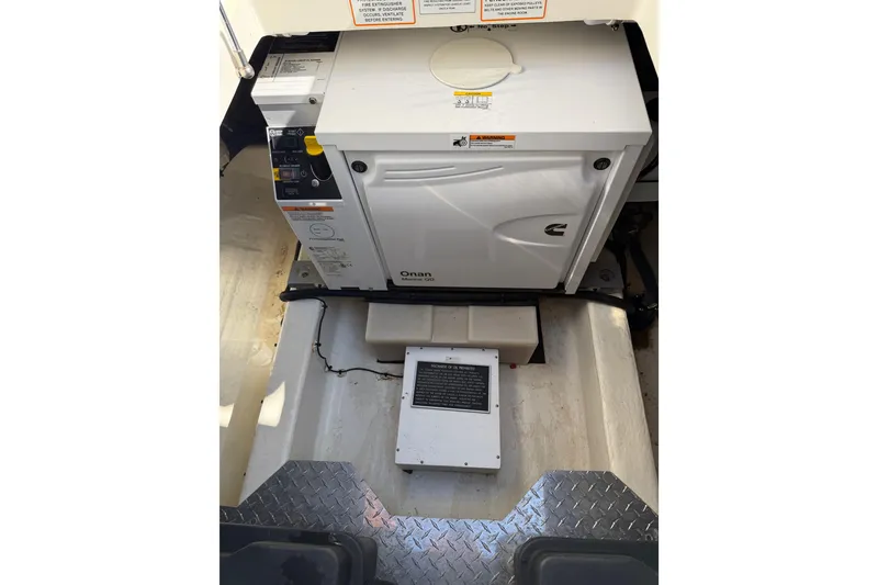 Slide: The Image of 2023 Back Cove 340 engine compartment with Onan generator. - 40