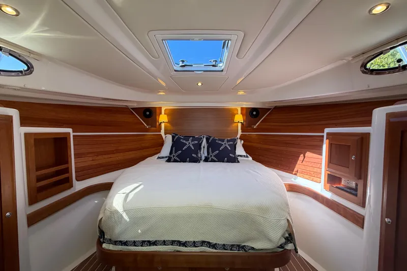 Slide: The Image of Luxurious cabin interior of 2023 Back Cove 340 yacht with elegant wood paneling. - 5