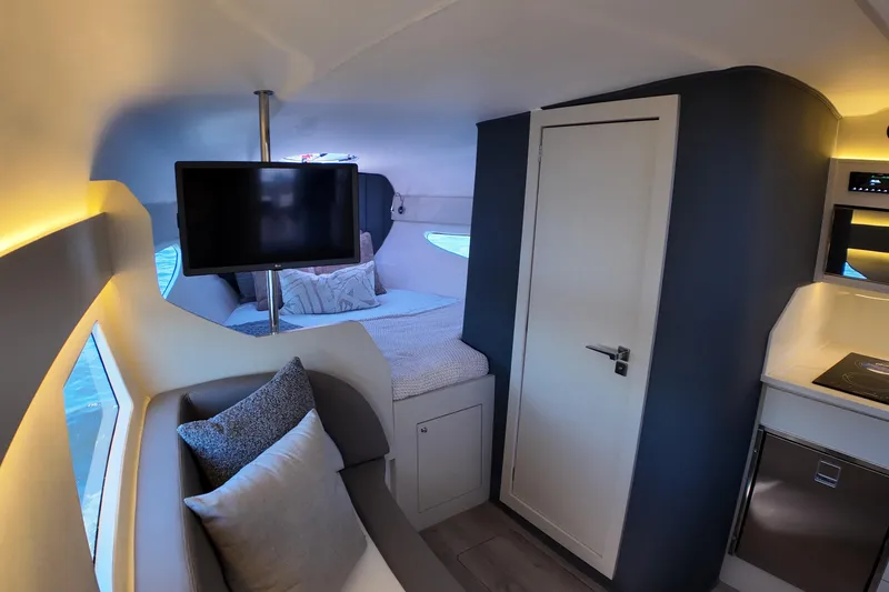 Slide: The Image of Luxurious interior of 2025 Valiatt 350GT yacht with modern amenities and cozy seating. - 12