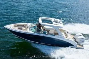 The Image of 2017 Regal 33 OBX boat cruising on open water. - 1