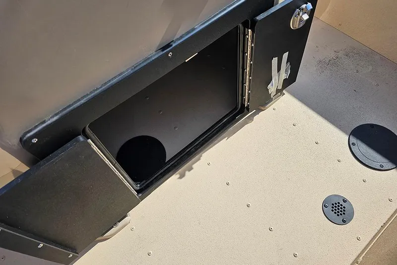 Slide: The Image of Open storage compartment on 2026 G3 Bay 17 boat deck. - 10