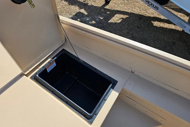 Slide: The Image of Open storage compartment on 2026 G3 Bay 17 boat, showing interior space. - 13