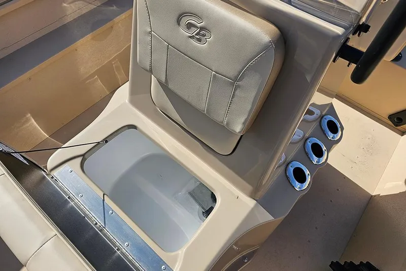 Slide: The Image of 2026 G3 Bay 17 boat interior with cushioned seat and rod holders. - 15