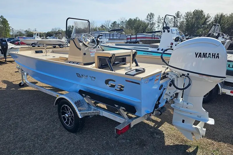 Slide: The Image of 2026 G3 Bay 17 boat with Yamaha engine on display outdoors. - 3
