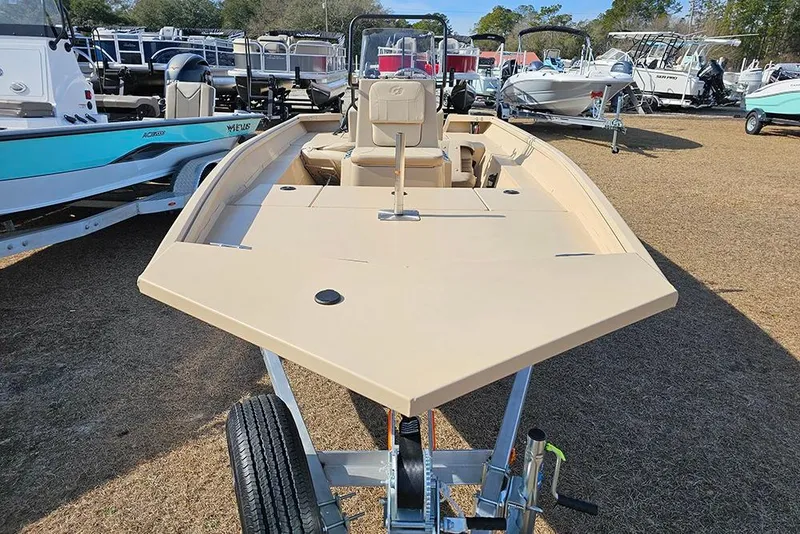 Slide: The Image of 2026 G3 Bay 17 boat on trailer, displayed outdoors among other boats. - 4