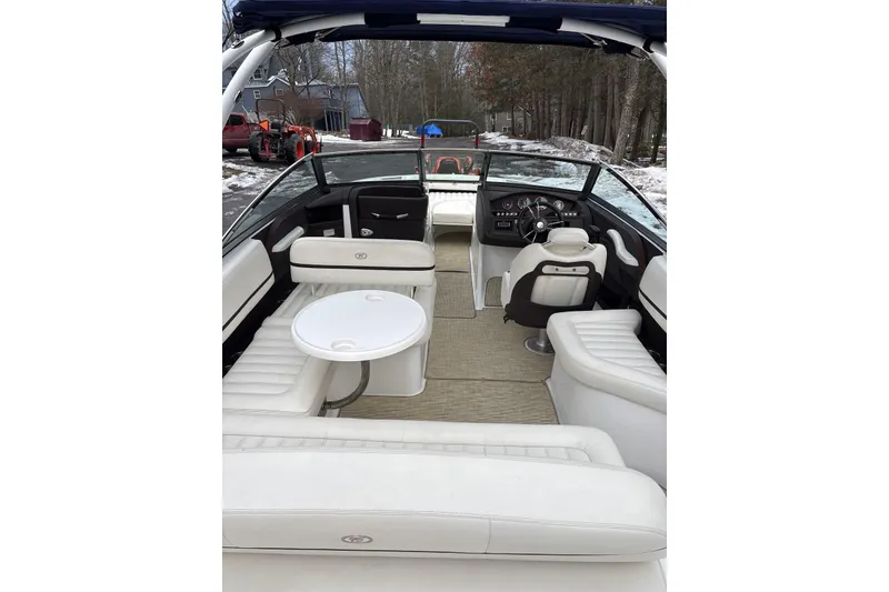 Slide: The Image of 2015 Cobalt R5 boat interior with white seating and steering wheel. - 14