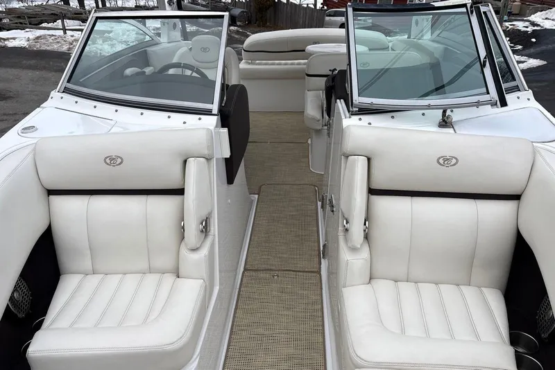 Slide: The Image of 2015 Cobalt R5 boat interior with white leather seats and dual windshields. - 18