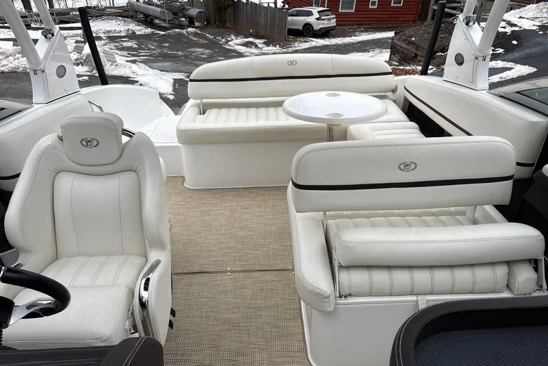 Slide: The Image of Luxurious interior of a 2015 Cobalt R5 boat with white leather seating. - 21
