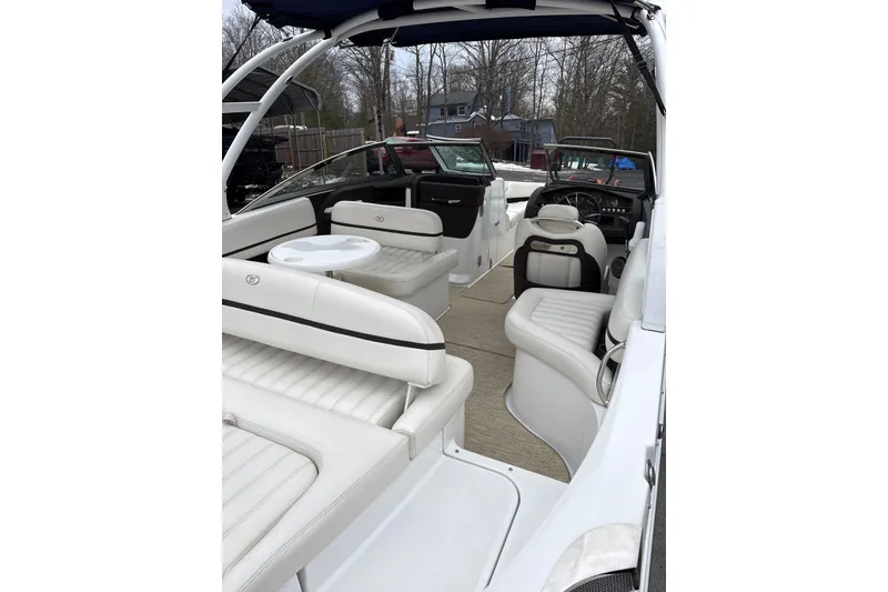 Slide: The Image of 2015 Cobalt R5 boat interior with white seating and steering wheel. - 23