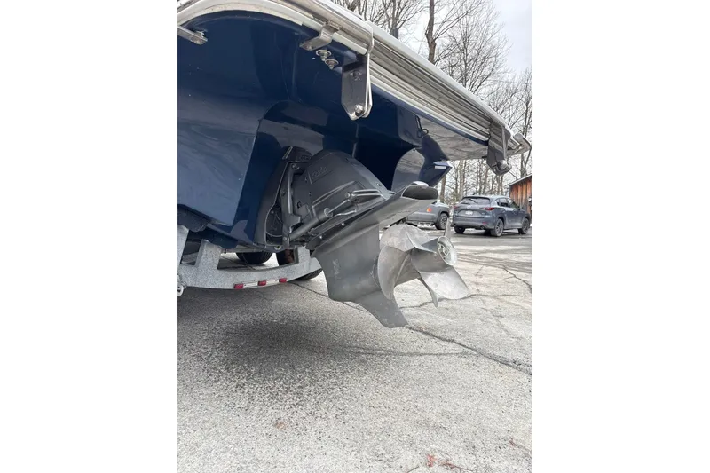 Slide: The Image of 2015 Cobalt R5 boat propeller and stern, parked on a trailer. - 7