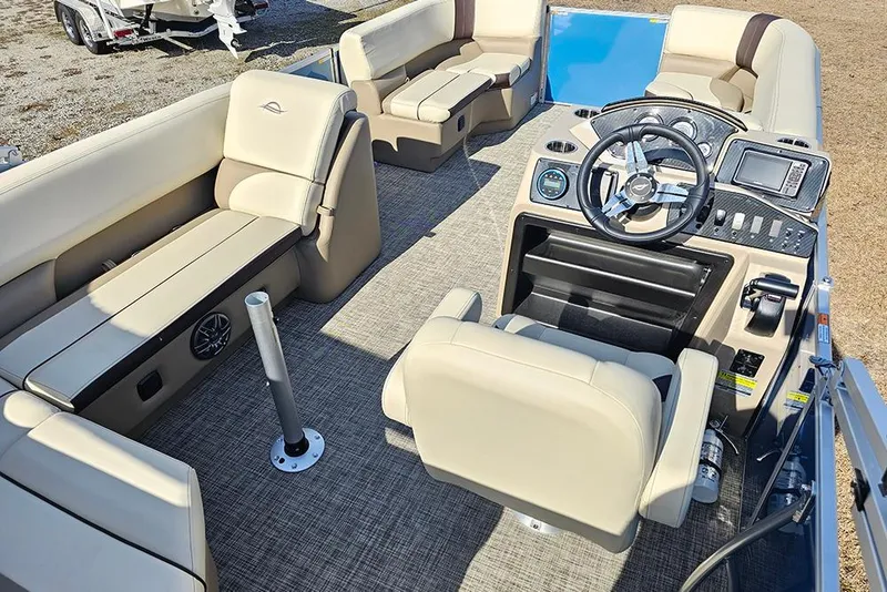 Slide: The Image of Interior of 2026 SunCatcher Select 20C pontoon boat with beige seating and modern dashboard. - 10