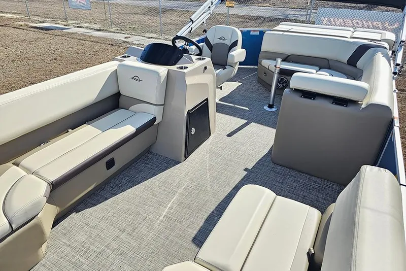 Slide: The Image of 2026 SunCatcher Select 20C pontoon boat interior with beige seating and modern design. - 11