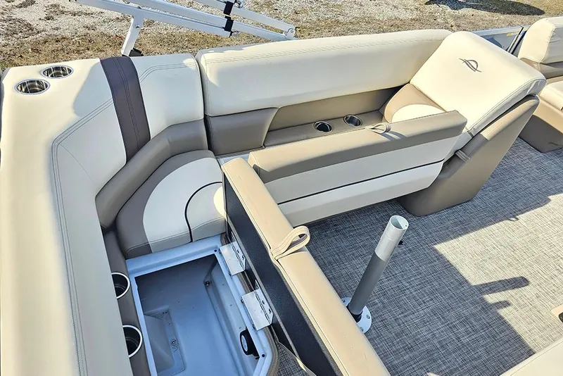 Slide: The Image of Luxurious seating on 2026 SunCatcher Select 20C boat with storage and cup holders. - 14