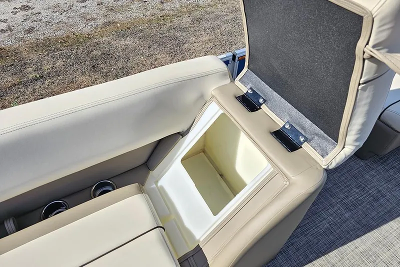 Slide: The Image of 2026 SunCatcher Select 20C boat seat storage compartment with cup holders. - 15