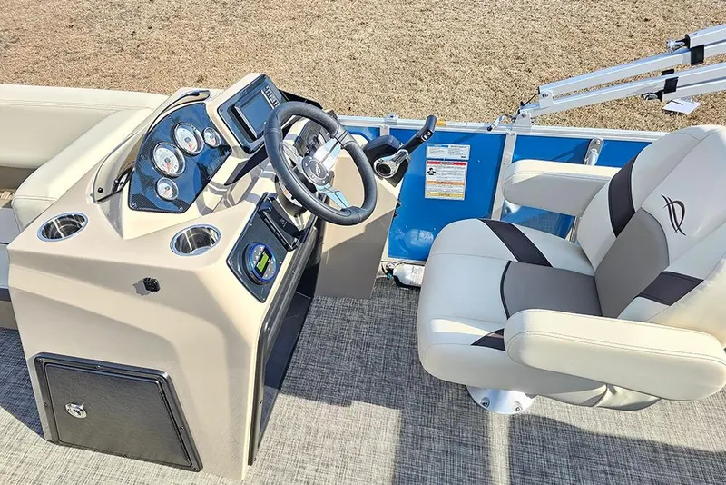 Slide: The Image of 2026 SunCatcher Select 20C boat interior with steering console and captain's chair. - 16