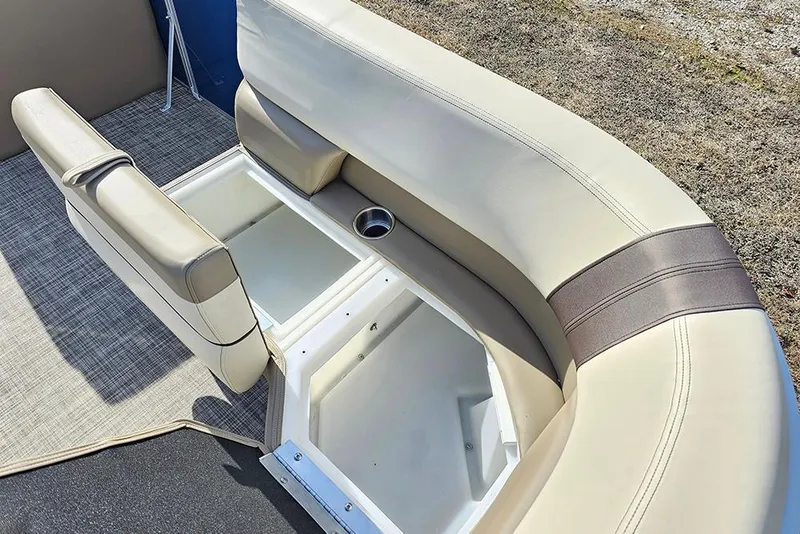 Slide: The Image of 2026 SunCatcher Select 20C boat seating with storage compartments and cup holder. - 23