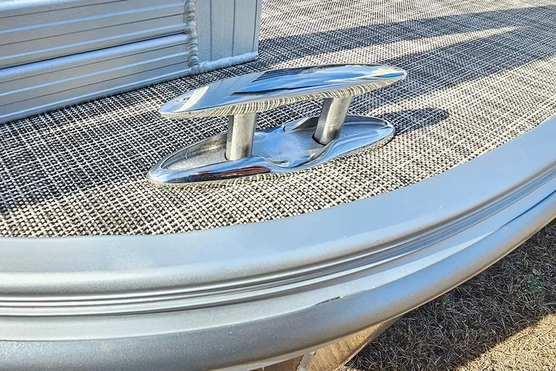 Slide: The Image of 2026 SunCatcher Select 20C boat cleat on textured deck surface. - 27