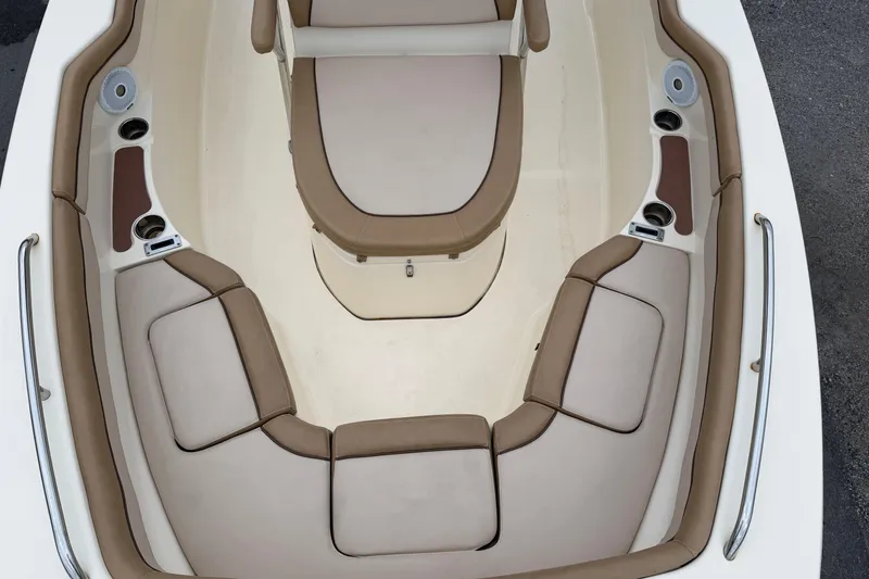 Slide: The Image of 2020 Scout 215 XSF boat interior with beige seating and cup holders. - 14