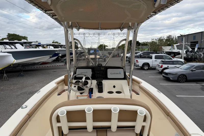 Slide: The Image of 2020 Scout 215 XSF boat interior with steering wheel and Garmin navigation system. - 7