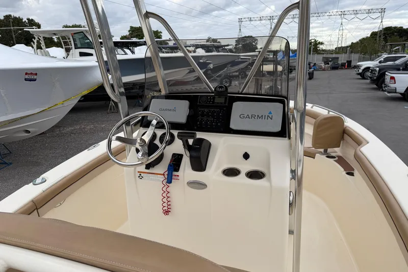 Slide: The Image of 2020 Scout 215 XSF boat interior with Garmin navigation system and steering wheel. - 8