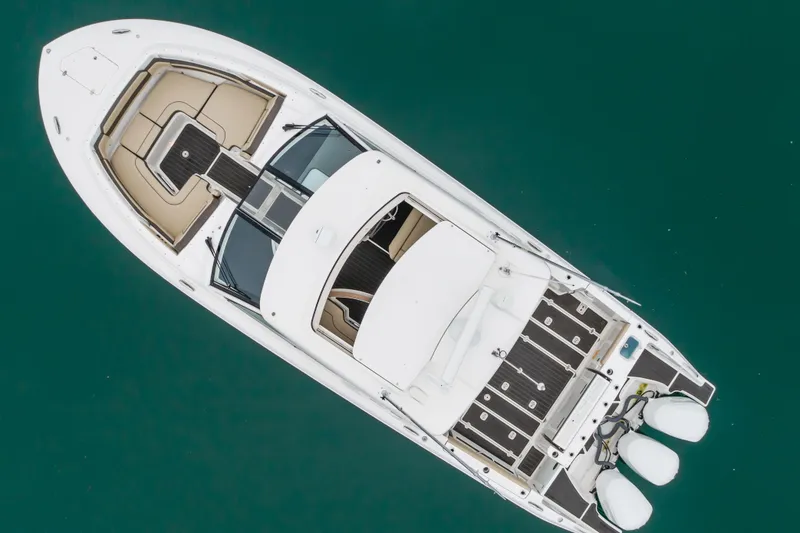 Slide: The Image of Aerial view of 2018 Pursuit boat on turquoise water. - 6