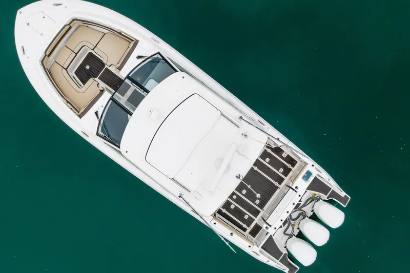 Slide: The Image of Aerial view of 2018 Pursuit boat on clear turquoise water. - 8