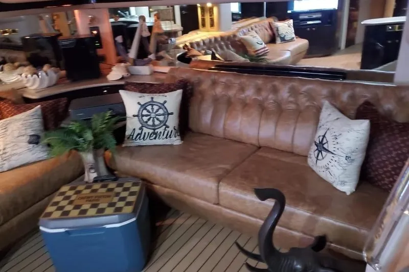 Slide: The Image of Luxurious 1999 Sea Ray 630 Sundancer interior with leather seating and nautical-themed decor. - 11