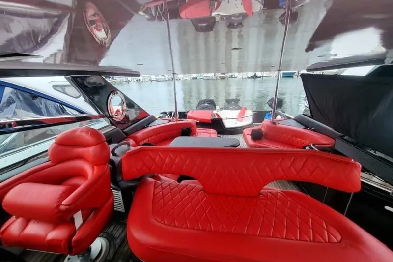 Slide: The Image of Luxurious red interior of 1999 Sea Ray 630 Sundancer yacht at marina. - 4