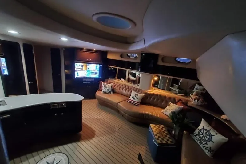 Slide: The Image of Luxurious interior of 1999 Sea Ray 630 Sundancer yacht with plush seating and modern amenities. - 7